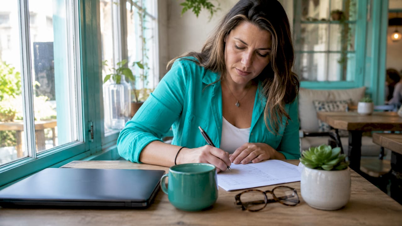 Small business owner reviewing website content checklist