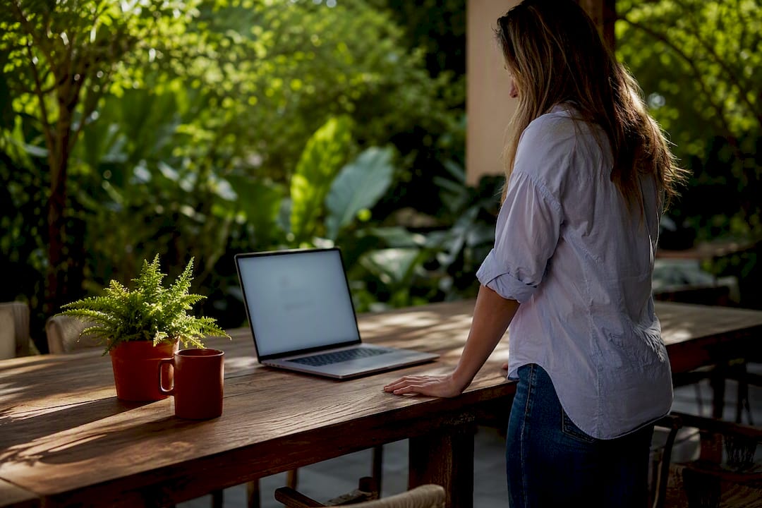 Laptop showing order confirmation page on wood desk